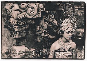 Asia Images Group - Indonesia, Bali, Gianyar, Oleg dancer waits to perform, sitting next to temple guardian. ( artistic grain)