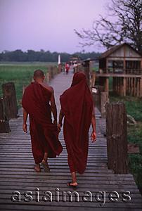 Asia Images Group - Myanmar (Burma), Mandalay, Buddhist monks crossing the U Bein bridge.