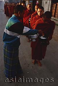 Asia Images Group - Myanmar (Burma), Inle lake, Buddhist monks receiving alms.