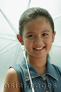 Asia Images Group - Young girl holding an umbrella