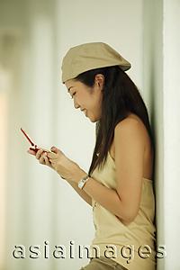 Asia Images Group - Young woman using mobile phone