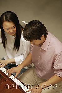 Asia Images Group - Couple at a piano, high angle view