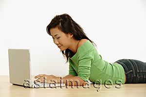 Asia Images Group - Young woman using laptop