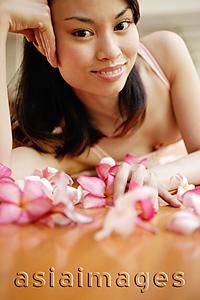 Asia Images Group - Young woman, hands on head, looking at camera