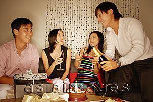 Asia Images Group - Couples sitting down, side by side, women holding wine glass