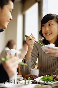 Asia Images Group - Couple eating at a Chinese restaurant