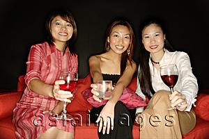Asia Images Group - Women with drinks, looking at camera