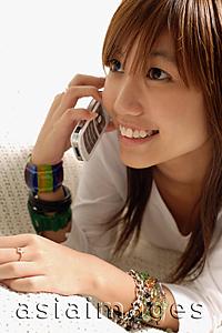 Asia Images Group - Young woman using mobile phone