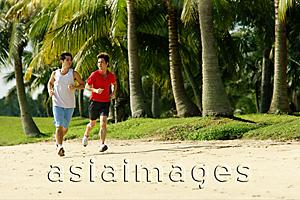 Asia Images Group - Men jogging along beach, side by side