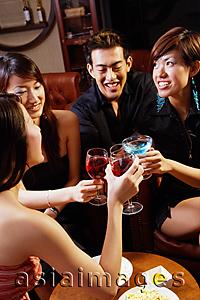 Asia Images Group - Young people toasting with drinks