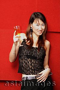 Asia Images Group - Young woman holding champagne glass, looking at camera