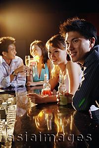 Asia Images Group - Young adults sitting at bar