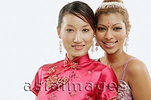 Asia Images Group - Two women in traditional costumes, looking at camera, portrait