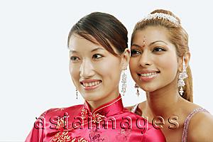 Asia Images Group - Two women in traditional costumes, looking away, portrait