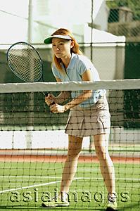 Asia Images Group - Woman playing tennis