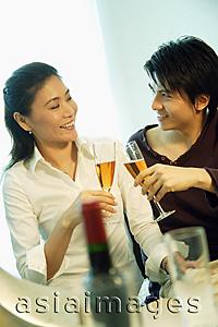 Asia Images Group - Couple toasting with champagne