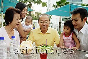 Asia Images Group - Three generation family celebrating grandfather's birthday