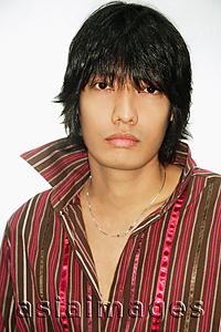 Asia Images Group - Young man looking at camera, portrait
