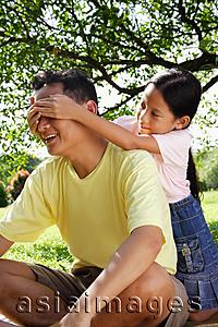 Asia Images Group - Daughter covering father's eyes with her hands