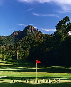 Asia Images Group - Late afternoon on green at golf course