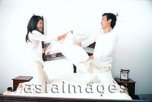 Asia Images Group - Couple pillow fighting