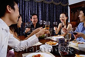 Asia Images Group - Adults at a dinner party