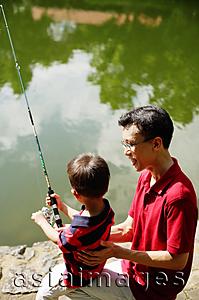 Asia Images Group - Father and young son, fishing