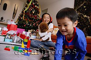 Asia Images Group - Children opening gifts on Christmas
