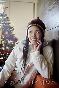 Asia Images Group - Woman in jacket and cap, smiling