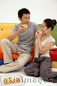 Asia Images Group - Couple eating pizza