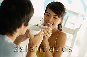 Asia Images Group - Couple having coffee, sitting face to face