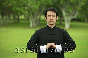Asia Images Group - Man in park, meditating, eyes closed