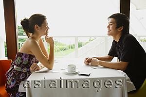 Asia Images Group - Couple in restaurant, talking