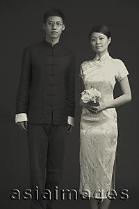 Asia Images Group - Black and white image of couple in traditional Chinese attire