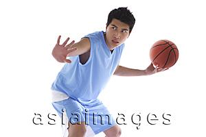 Asia Images Group - Young man holding basketball