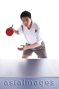 Asia Images Group - Young man playing table tennis