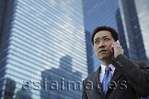 Asia Images Group - Mature man wearing a suit and talking on the phone