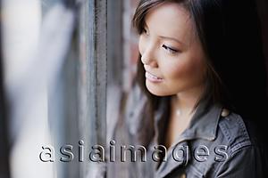 Asia Images Group - Woman looking out a window