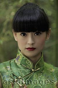 Asia Images Group - Portrait of young woman wearing traditional Chinese dress.