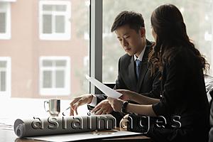 Asia Images Group - young man and woman working in an office