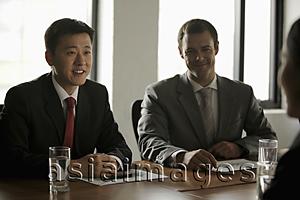 Asia Images Group - Business men having a meeting
