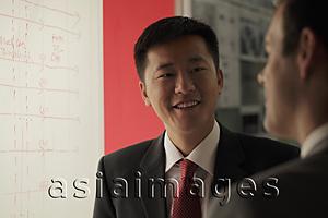 Asia Images Group - Two business men talking