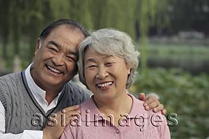 Asia Images Group - Head shot of older couple smiling outdoors