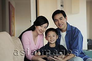Asia Images Group - Mother, father and son holding tablet