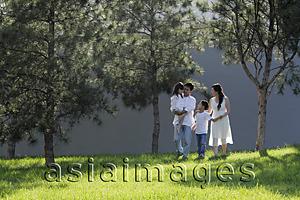 Asia Images Group - Young family walking together in a park