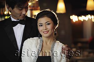 Asia Images Group - Young couple dressed elegantly at night