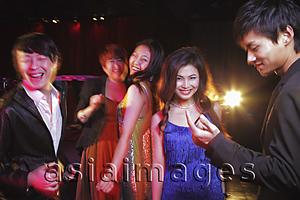 Asia Images Group - Young people dancing in a club at night