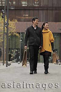 Asia Images Group - Young couple shopping together outdoors