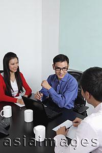 Asia Images Group - Three people having a meeting