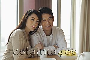 Asia Images Group - Young couple sitting together in their home